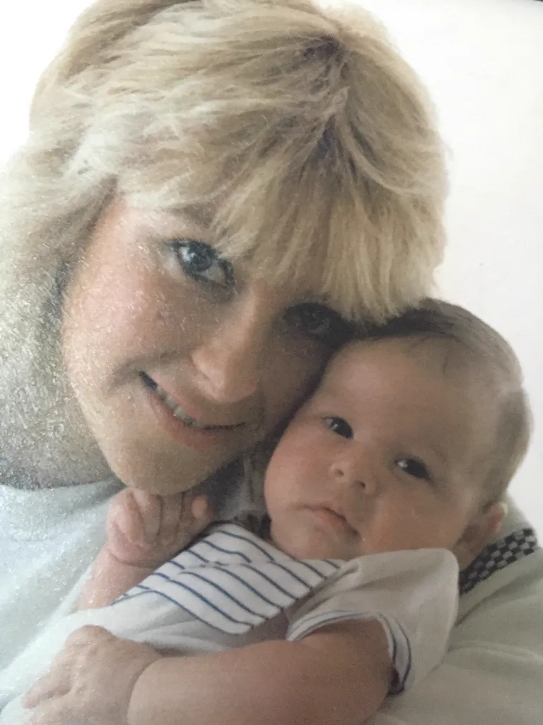 Pam holding her baby son, Zander